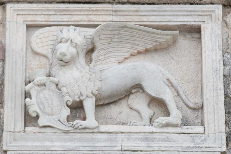 A winged beast statue on the city walls of Kotor, Montenegro.