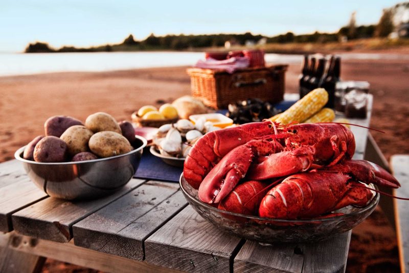 A spread of lobster and seafood at a beach clambake in Charlottetown, Prince Edward Island, Canada.