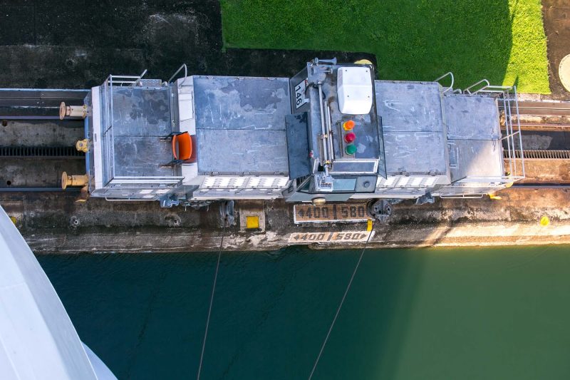 A look down at an electric locomotive, or "mule," alongside Norwegian Jade in a Panama Canal lock.