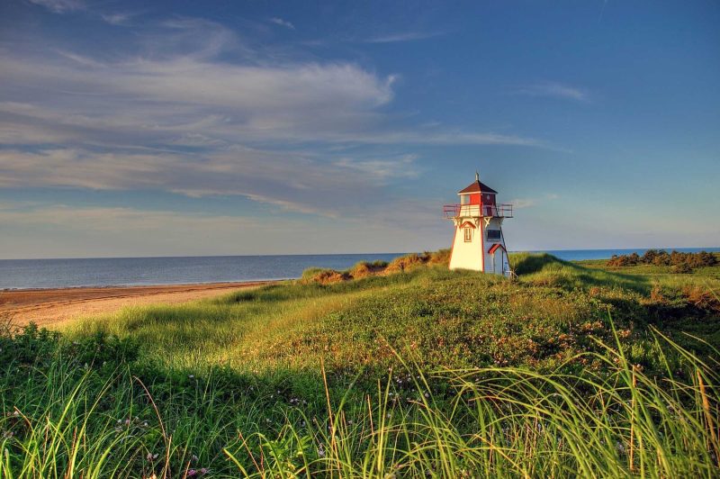 Covehead Harbour Lighthouse stands astride the entrance to Covehead Bay inside Prince Edward Island National Park in Canada.