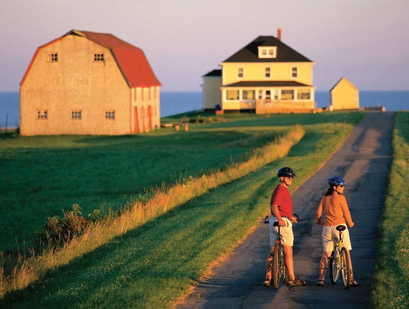 Cyclists take in the wide open spaces in Charlottetown, Prince Edward Island, Canada.