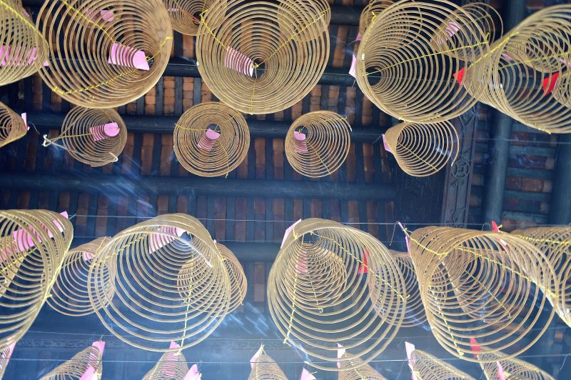 Beautiful curled incense hangs from a  temple in Hanoi, Vietnam. 