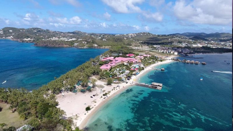 Sandals Resort (light red rooftops) and Pigeon Island Beach in the northwest corner of St Lucia (drone image).