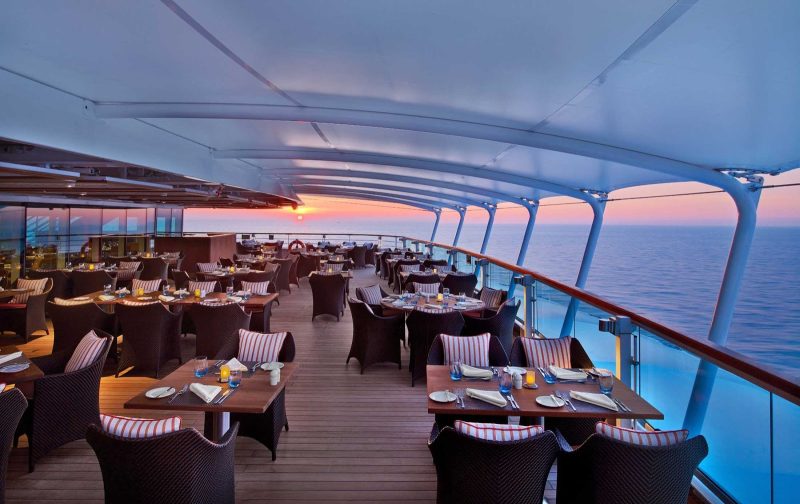 Enjoy al fresco dining on deck in The Colonnade aboard Seabourn Encore. 