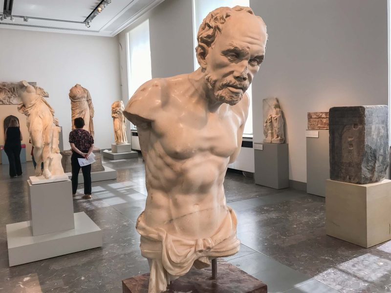 Torso of an Old Fisherman, a Roman sculpture in marble, dates to 200 B.C. at the Altes Museum in Berlin.