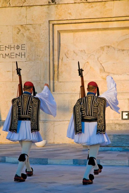 See the Evzones in the changing of the guard ceremony every hour on the hour in Athens, Greece.