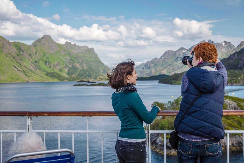 Capture the dramatic scenery of Nordland from the deck of Hurtigruten's Midnatsol during your summer journey along Norway's scenic coastline.