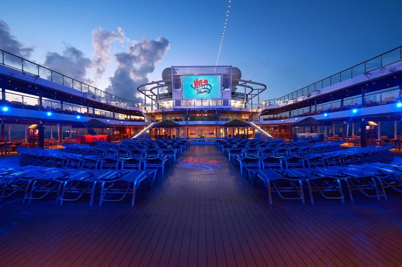 Jump in or grab a comfortable lounge and a snack for evening viewings of popular movies on Carnival Panorama.