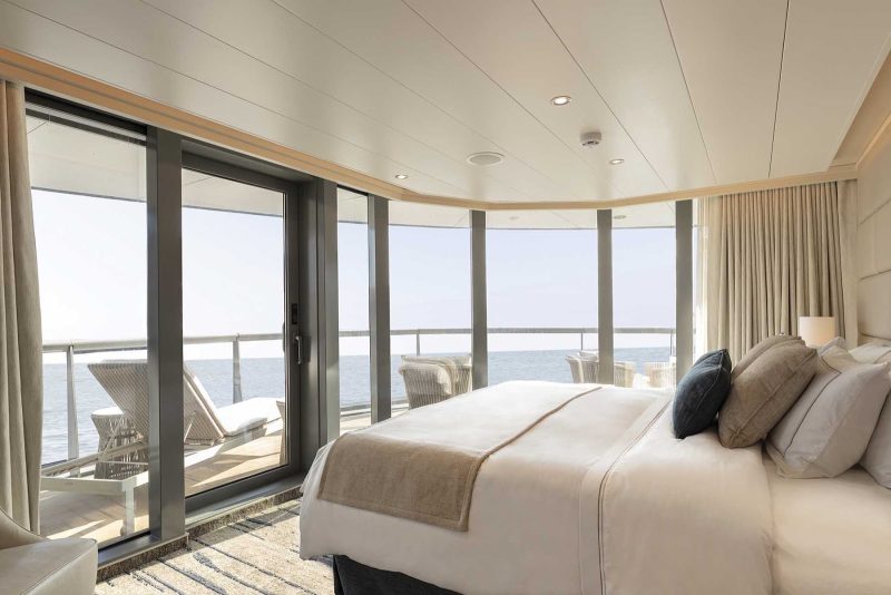 The light-filled bedroom of the Royal Suite on Silver Origin from Silversea.