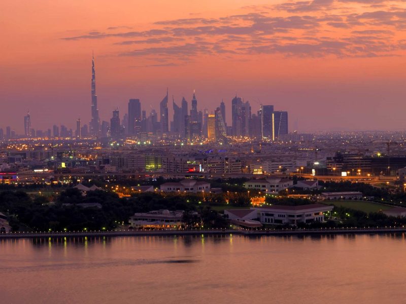 The cityscape of Dubai at sunset.