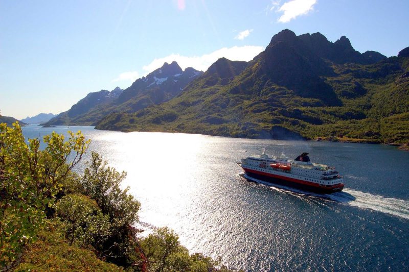 Sailing through Norway's Raftsundet strait on a glorious autumn day aboard the Hurtigruten expedition ship Richard With.