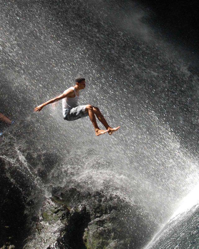 Taking a running jump at the Falls of Baleine on St. Vincent.