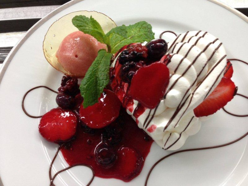 Go ahead, indulge on a strawberry pavlova on a SeaDream cruise.