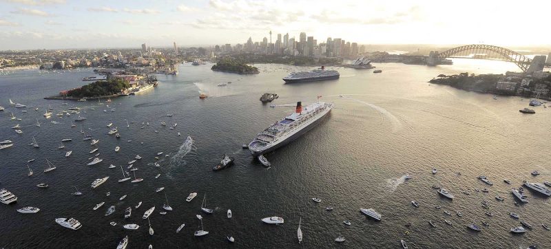 Queen Victoria and Queen Mary 2 have a royal rendezous as other vessels join in the celebration in Sydney Harbour. Cunard is one of the leading cruise lines offering world cruises.