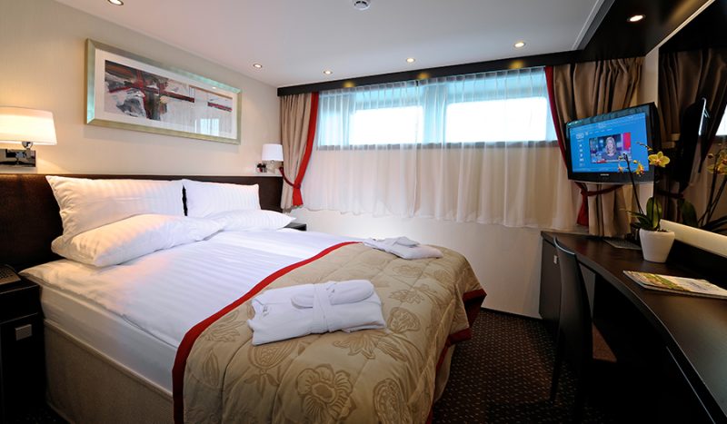 Avalon Panorama deluxe staterooms feature a well-stocked minibar and flat-screen satellite TV.