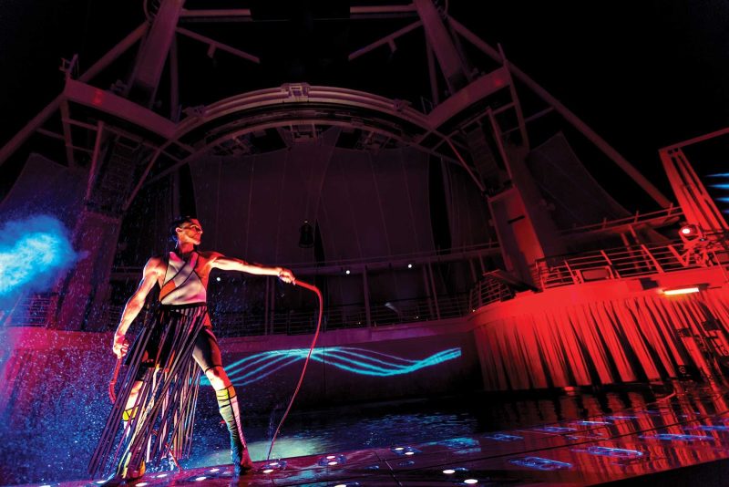 A performer on the platform of the family-friendly AquaTheater on Harmony of the Seas.