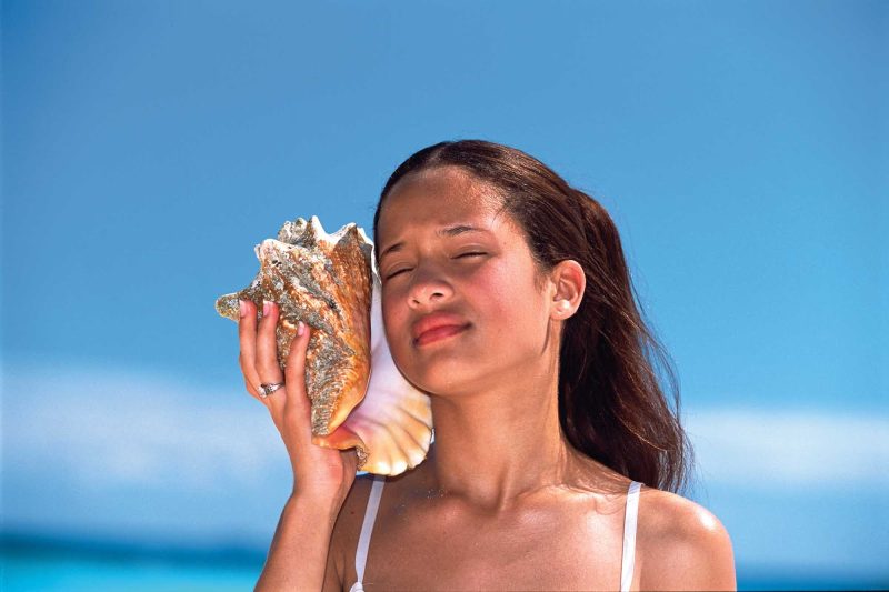 Girl with a conch shell in the Dominican Republic.