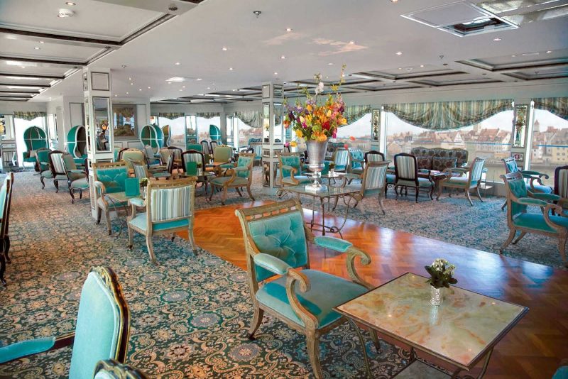 The S.S. Antoinette's Salon du Grand Trianon is ideally positioned for you to admire the breathtaking vistas of the Rhine River.