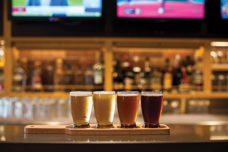 A flight of four draft beers awaits at Playmakers Sports Bar.