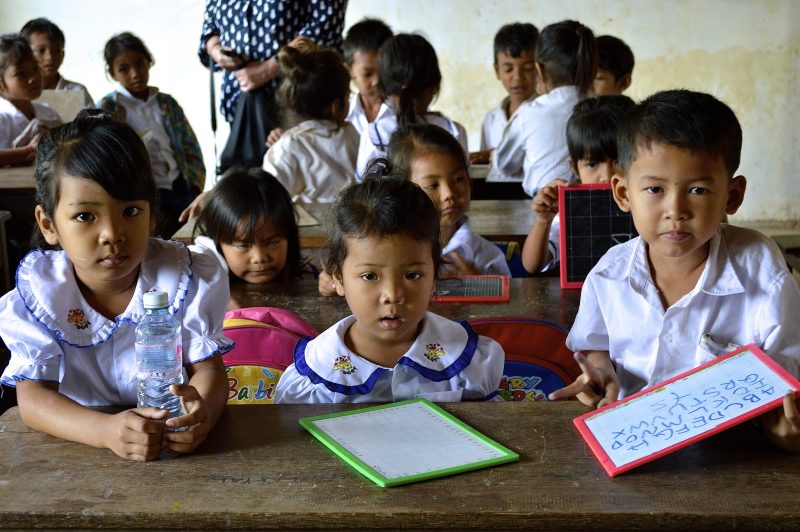 Children in a classroom in Vietnam were eager to practice their English with foreign visitors. 