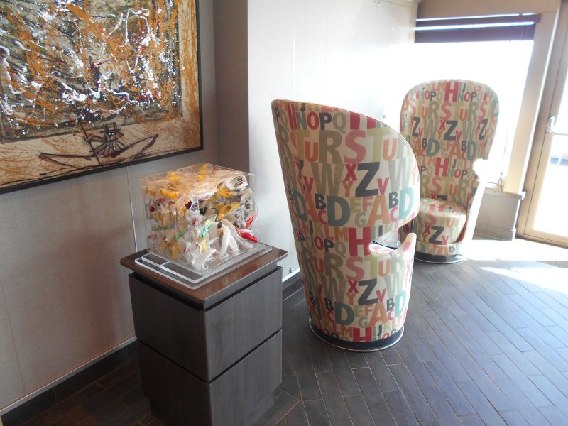The Arts Cafe is a whimsical social center where passengers gather for sweets, sandwiches, drinks and/or coffee