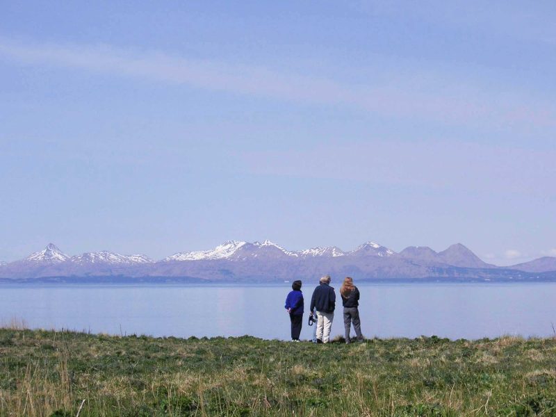 Travelers take in the expansive landscape on Kodiak Island off the southern coast of Alaska.