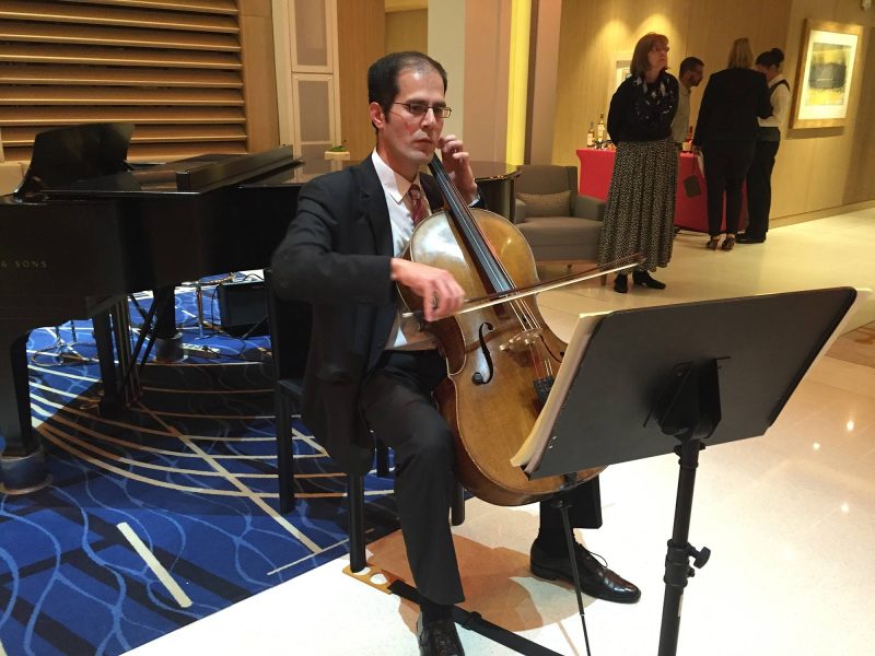A cellist performs in the Living Room of Viking Star.