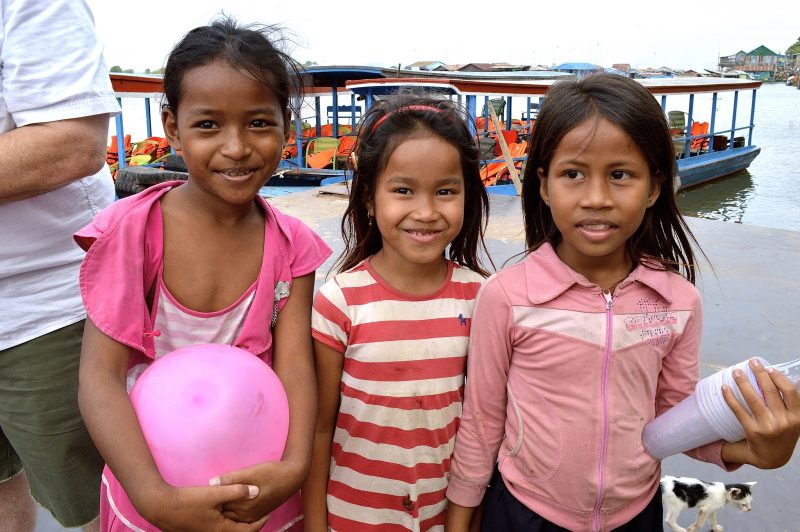 Three young girls were happy to see travelers from the U.S. visit Cambodia.
