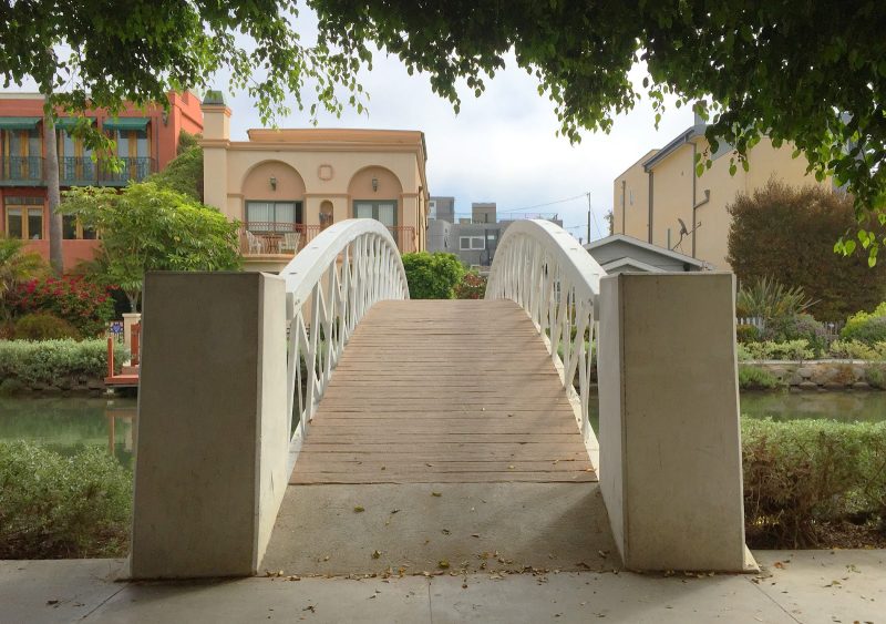 A bridge leads to the canals of Venice. (Yes, California's Venice has them too.)