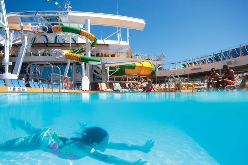 A girl swims underwater in one of the pools on Harmony of the Seas.