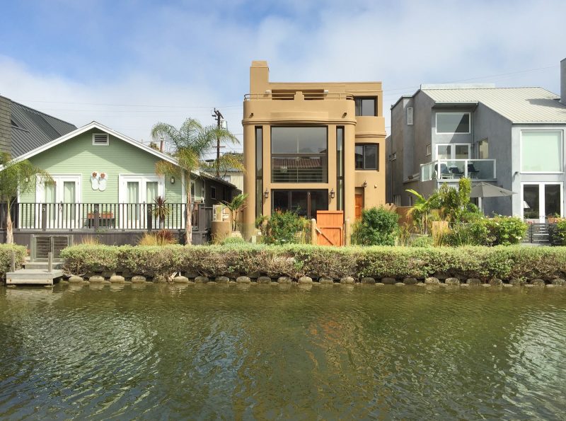 Expensive houses line the canals of Venice in the city of LA.