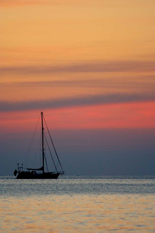 Sailboats in Cuba at sunset.