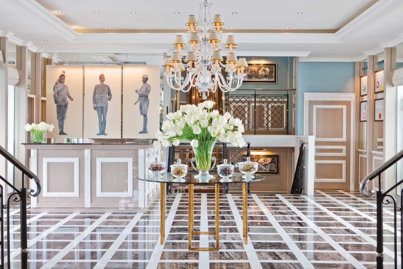 The striking, light-filled lobby of Uniworld's River Duchess.