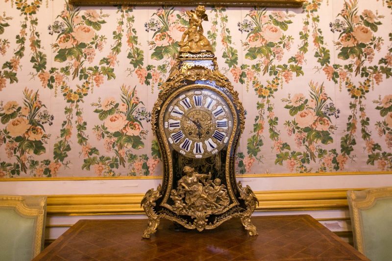 A French-made Commode Clock in the Small Passage Room in Peterhof Palace near St. Petersburg, Russia.