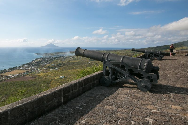 Smoke from a cannon volley at Brimstone Hill Fortress? Nope. A brushfire below in Sandy Point Town, St. Kitts. The island of St. Eustatius looms in the distance.