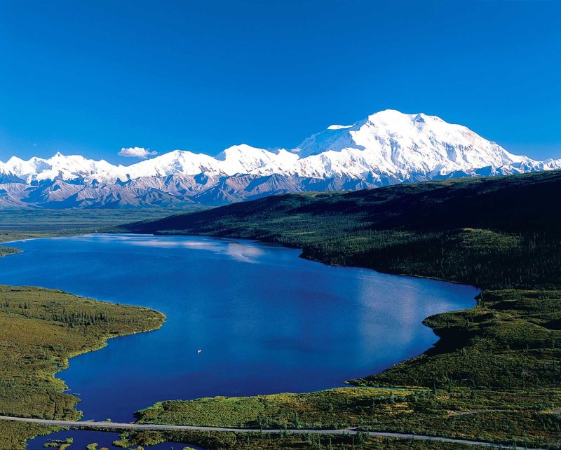 Throughout the day, lakes and mountain vistas create beautiful landscapes in Denali National Park, Alaska.