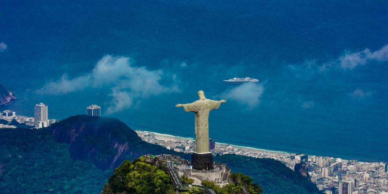 A panorama of the Christ the Redeemer statue overlooking Guanabara Bay and Rio de Janeiro. 