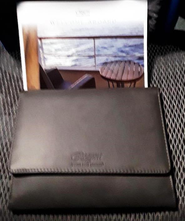 Always a class act. This is how Regent Seven Seas sends cruise tickets. In a handsome leather-like folder. Doing the Mariner again in September.