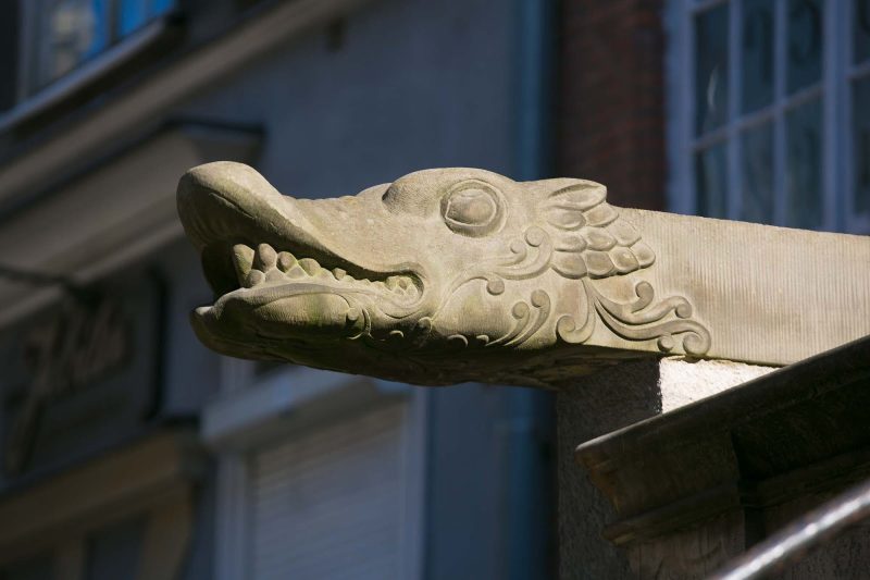 A dragon carving on a historic street in Old Gdansk, Poland.