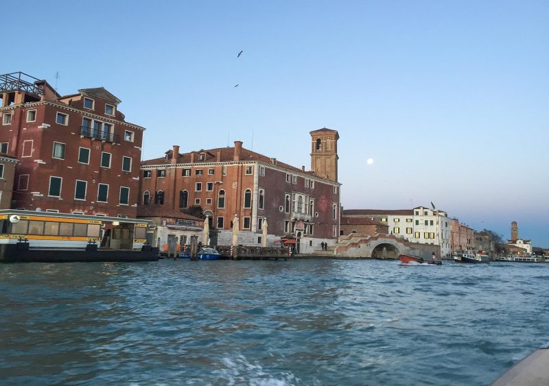 Buildings along the canals of Venice at daybreak.