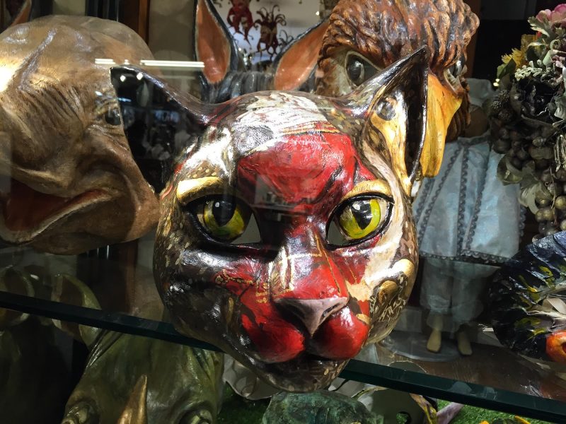 A cat mask in a shop window along the Procuratie Vecchie on Piazza San Marco, Venice.