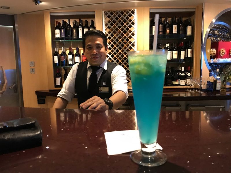 A blue cocktail served in the Pinnacle Bar during a cruise on ms Oosterdam.