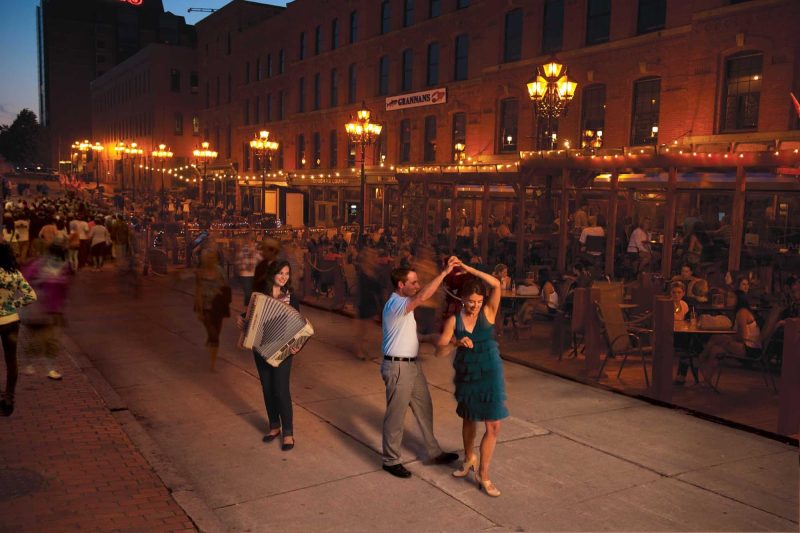 Music and dining go hand in hand as evening descends on a row of restaurants on the Saint John Boardwalk.