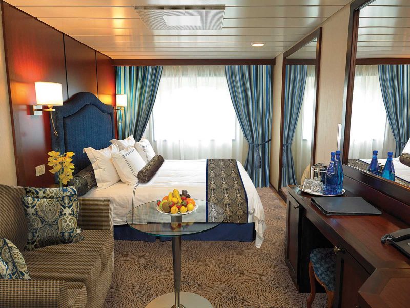 The C Level Deluxe Ocean View staterooms on Oceania Insignia contain custom-designed furnishings, queen or two twin bed accommodations, spacious seating area, vanity desk and breakfast table. At 165 square feet, they're located on decks 4,6 and 7.   