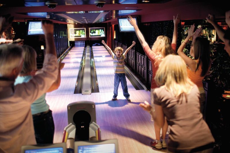 Go bowling with the family during your cruise on Norwegian Bliss.