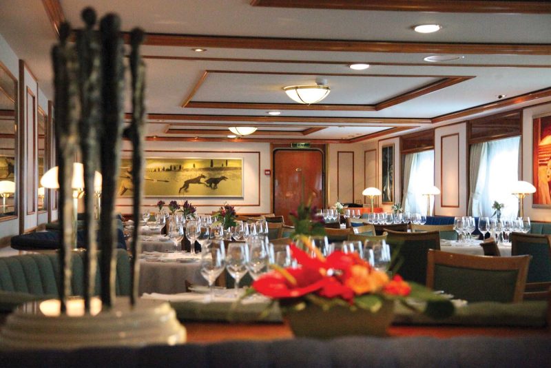 Get recharged for the next day's adventure in National Geographic Orion's dining room on your Lindblad Expeditions trip. 