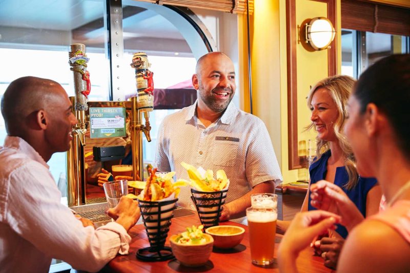 Enjoy private-label brews, appetizers and upbeat tunes from live musicians at RedFrog Pub on your Carnival cruise. 
