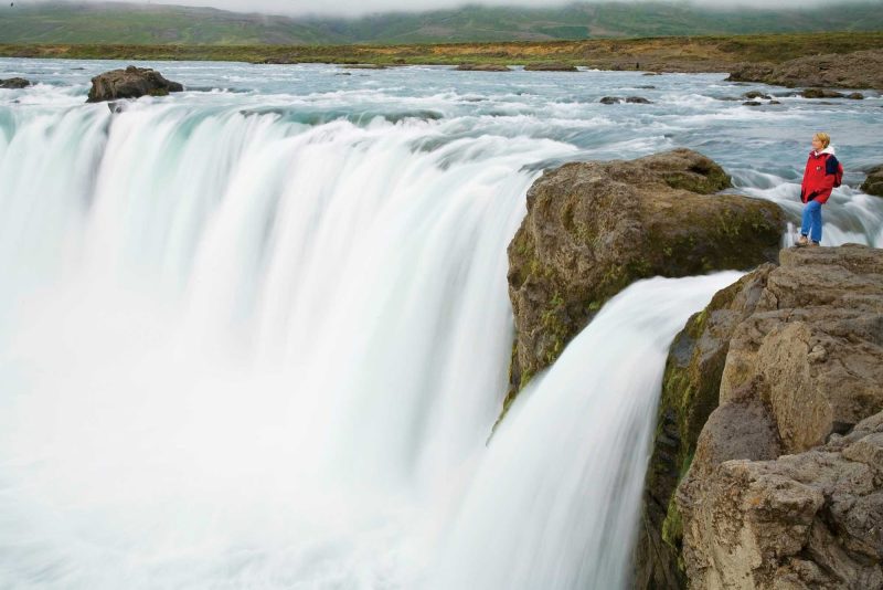 Take in the incredible sights when you visit the magnificent Godafoss Waterfall on a Lindblad Expeditions tour of Iceland.