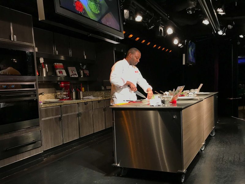A cooking demonstration in America's Test Kitchen on ms Oosterdam.