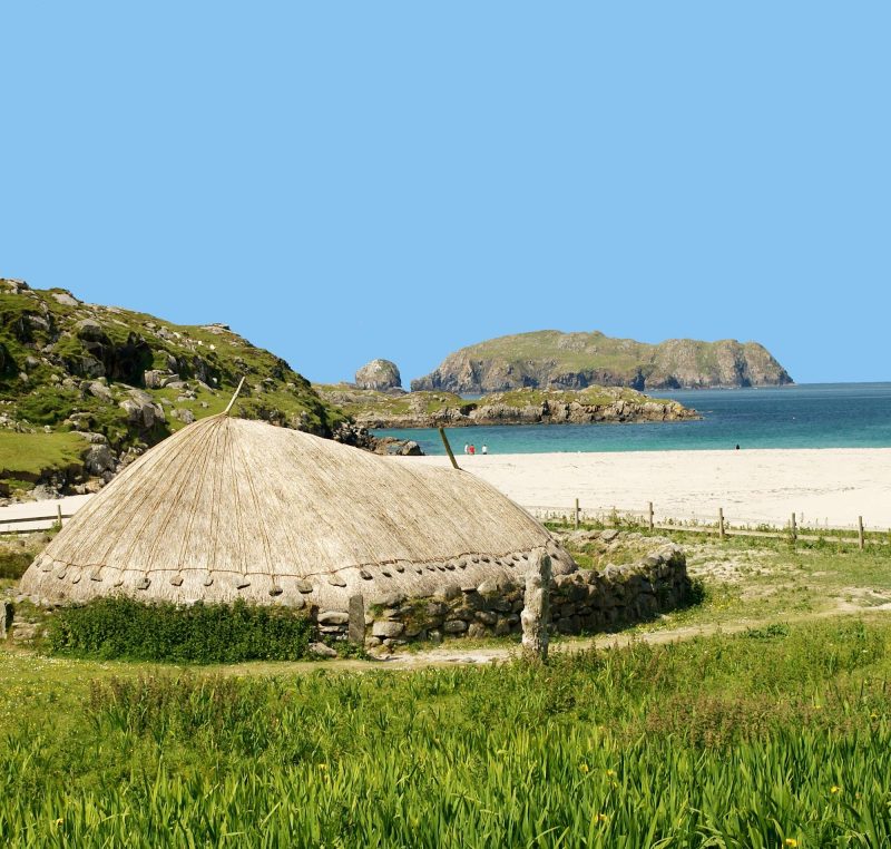 Closeup of a re-creation of a thatched house from the Iron Age House at Bosta Beach in Great Bernera in the western islands of Scotland.